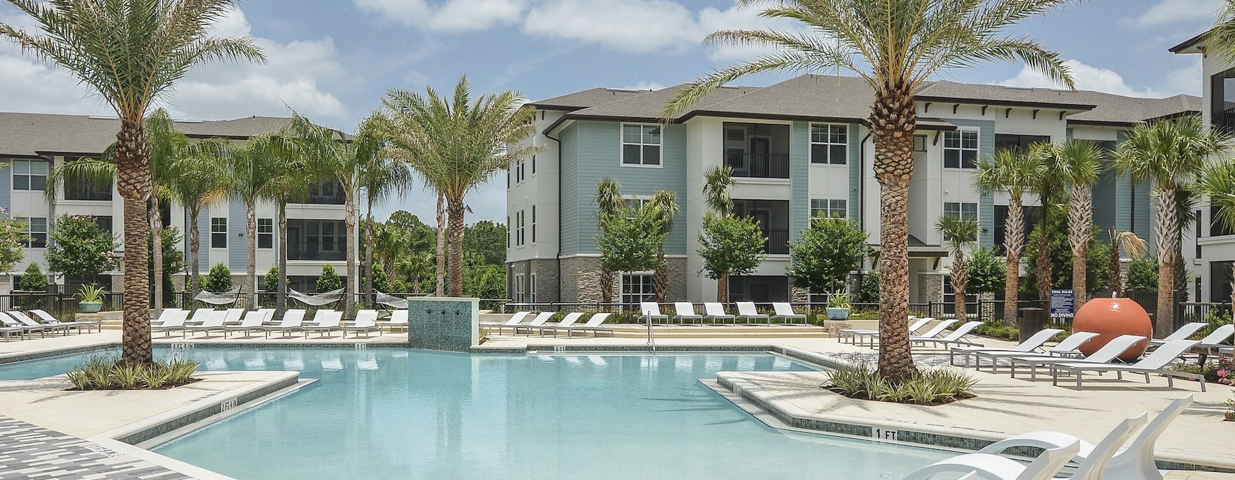 a pool with chairs around it