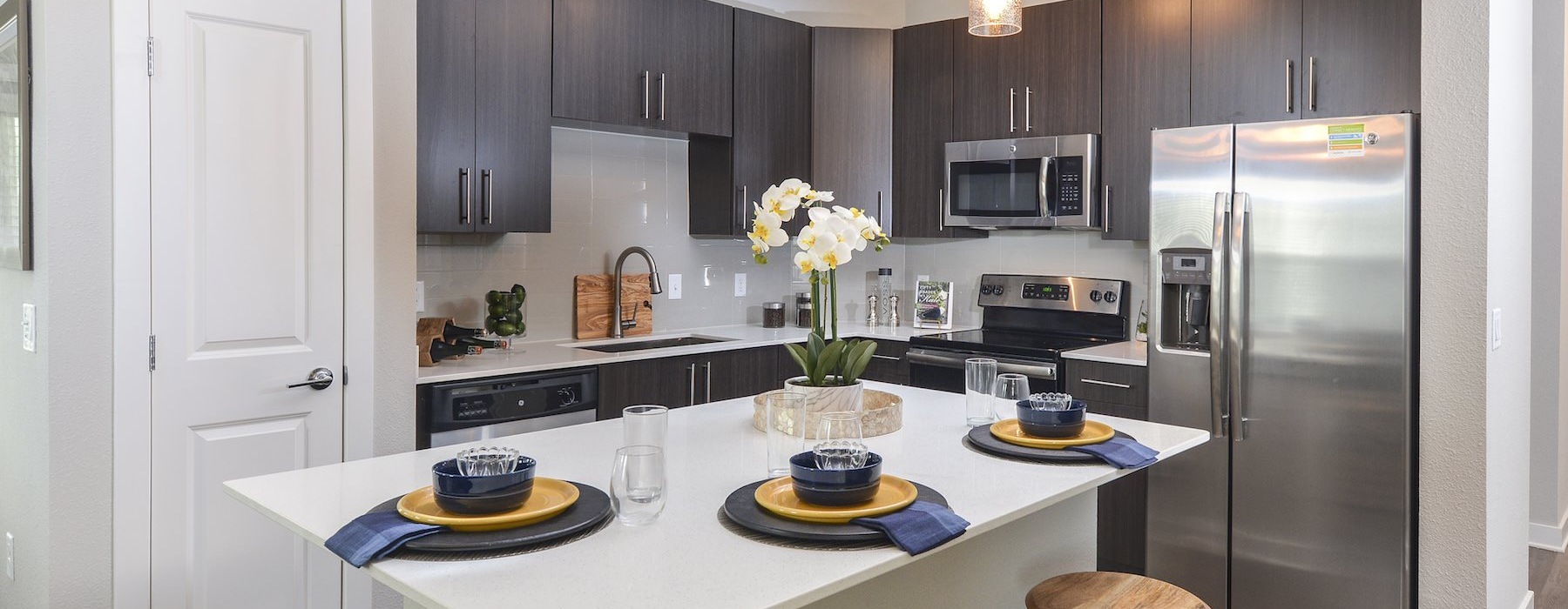 a kitchen with a table and chairs