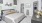 a bedroom with a bed and a desk