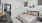 a bedroom with a bed and a table