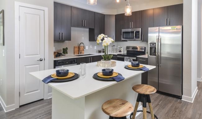 a kitchen with a table and chairs